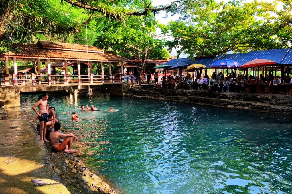 lagoon with people in the water and the shore