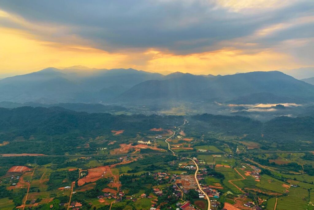 sunrise in a hot air balloon looking at mountains