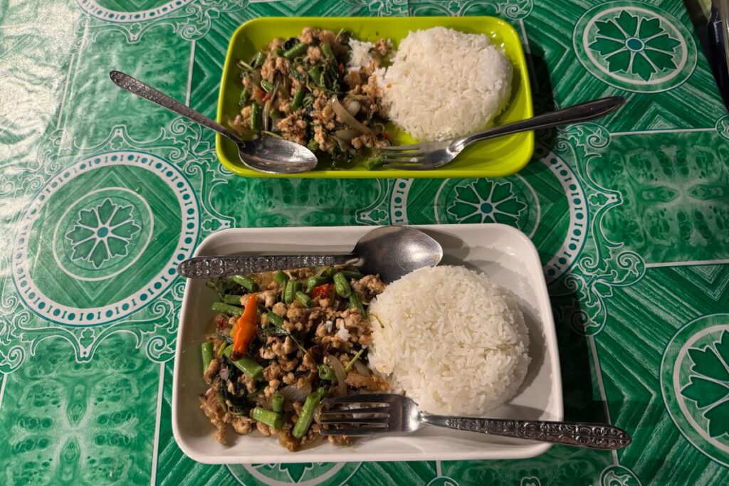 two rice with meat and vegetable dishes