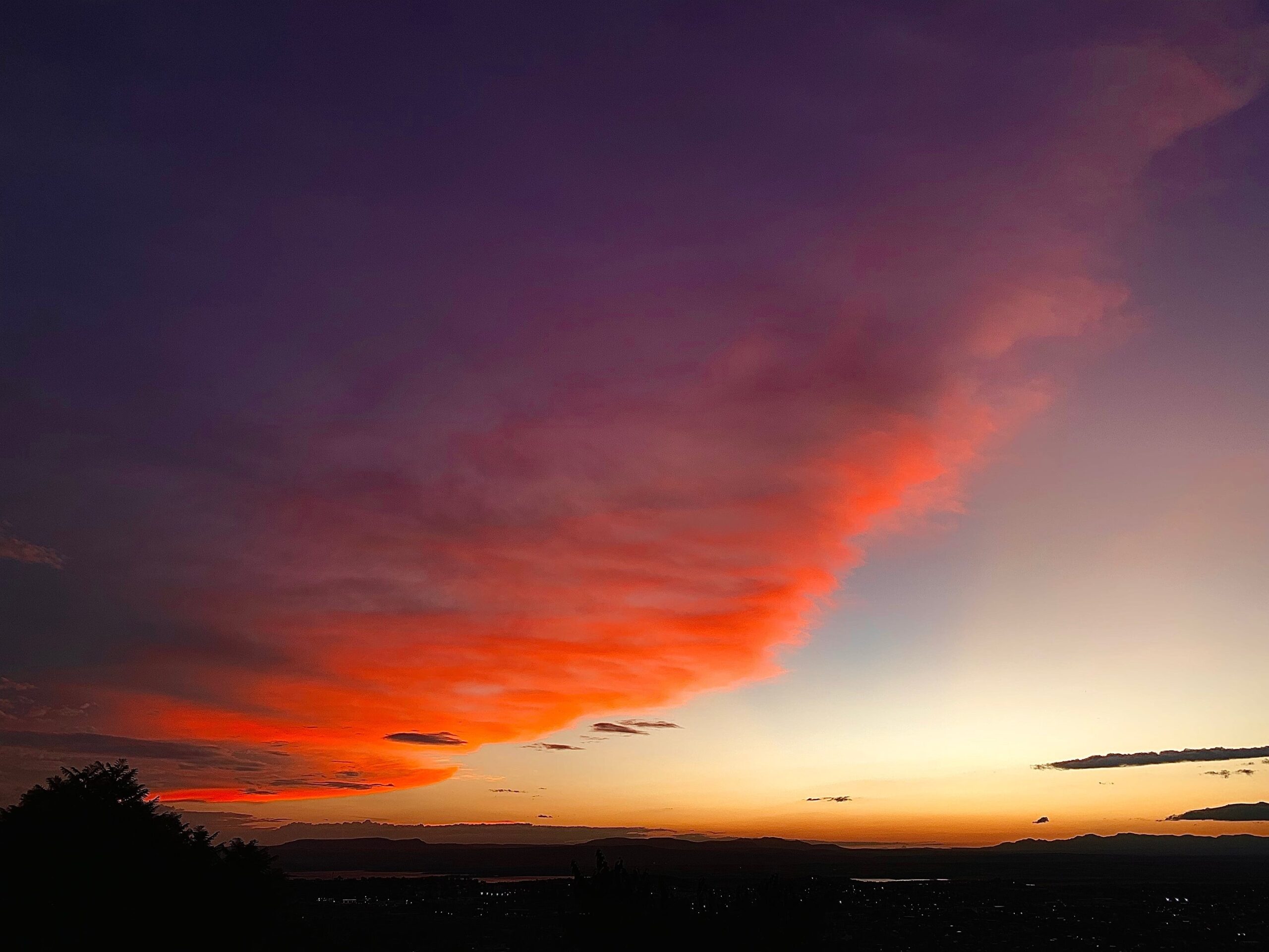 sunset with wispy red clouds