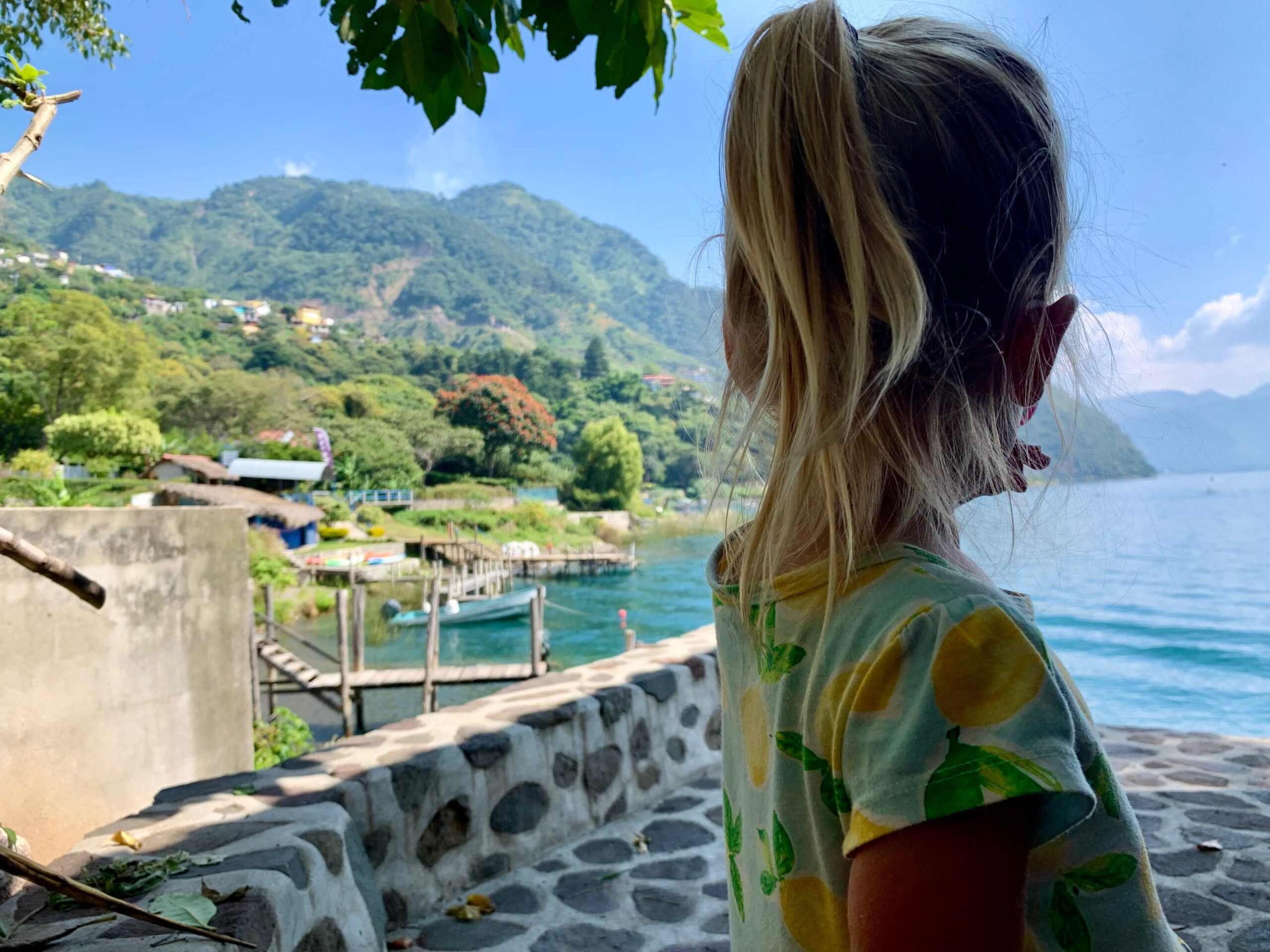 girl looking out onto a lake
