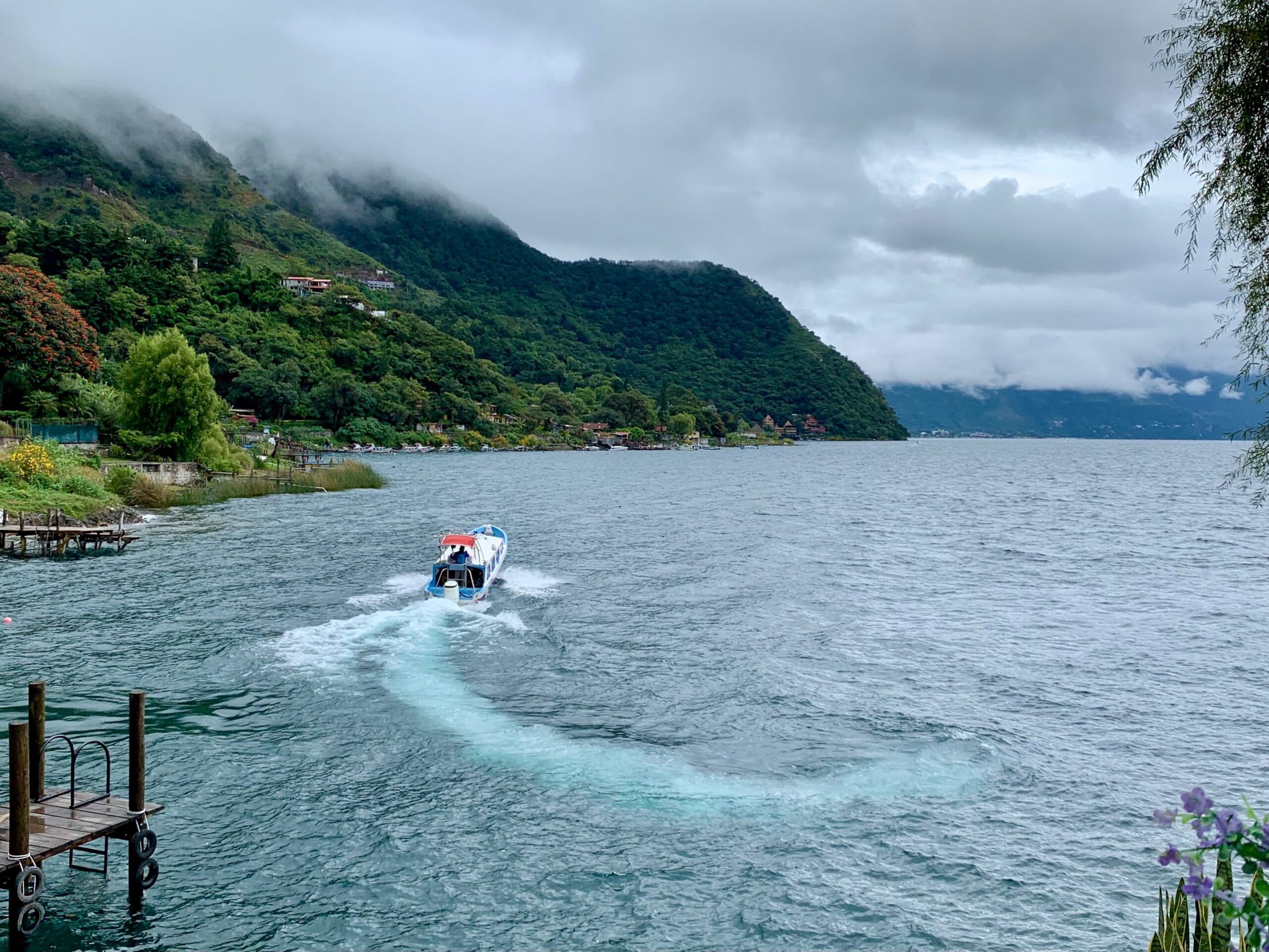 boat on a lake with lush scenery