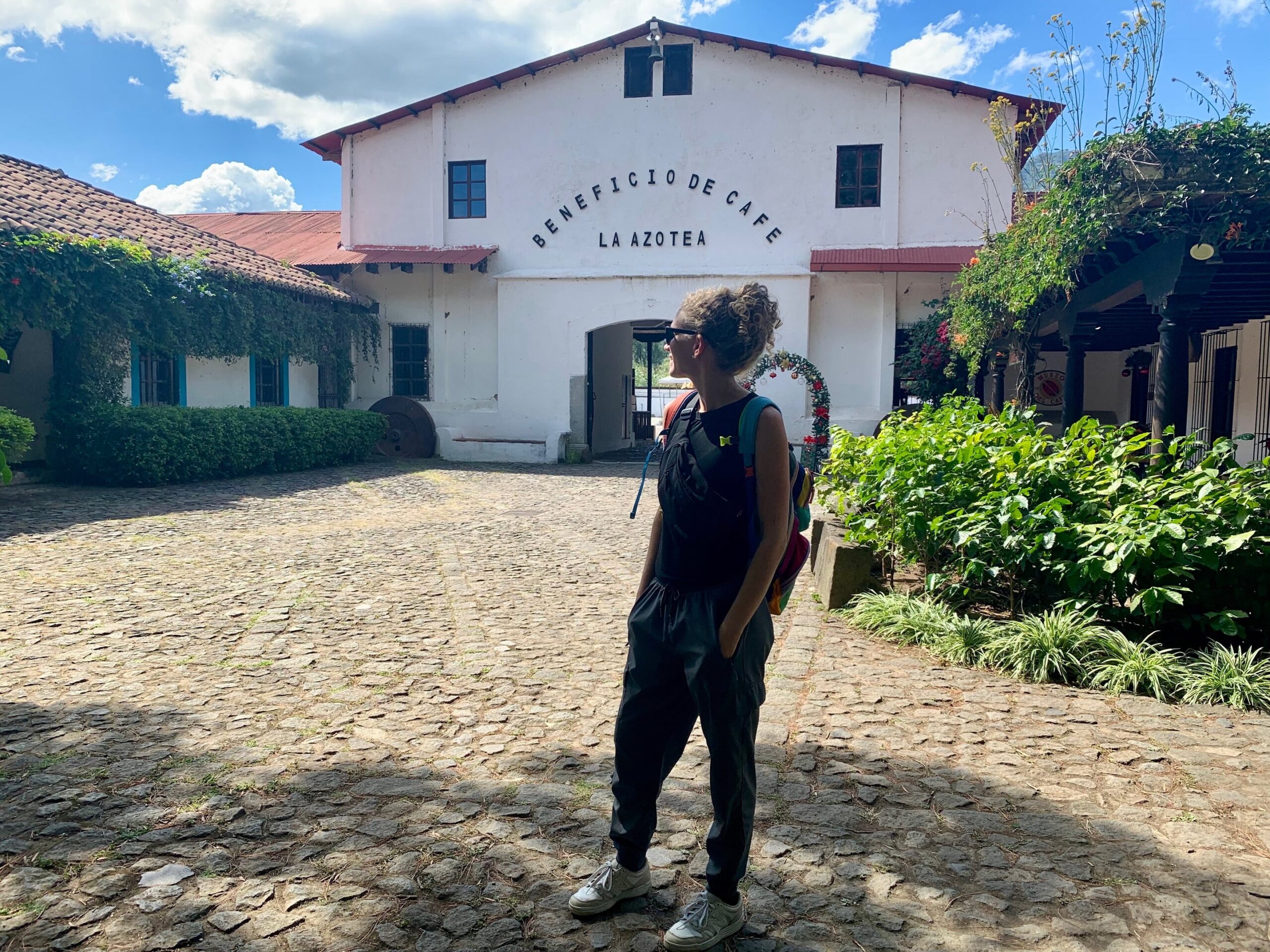 Women at entrance with buildings in background