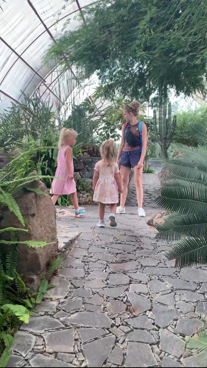 mother and children in a garden