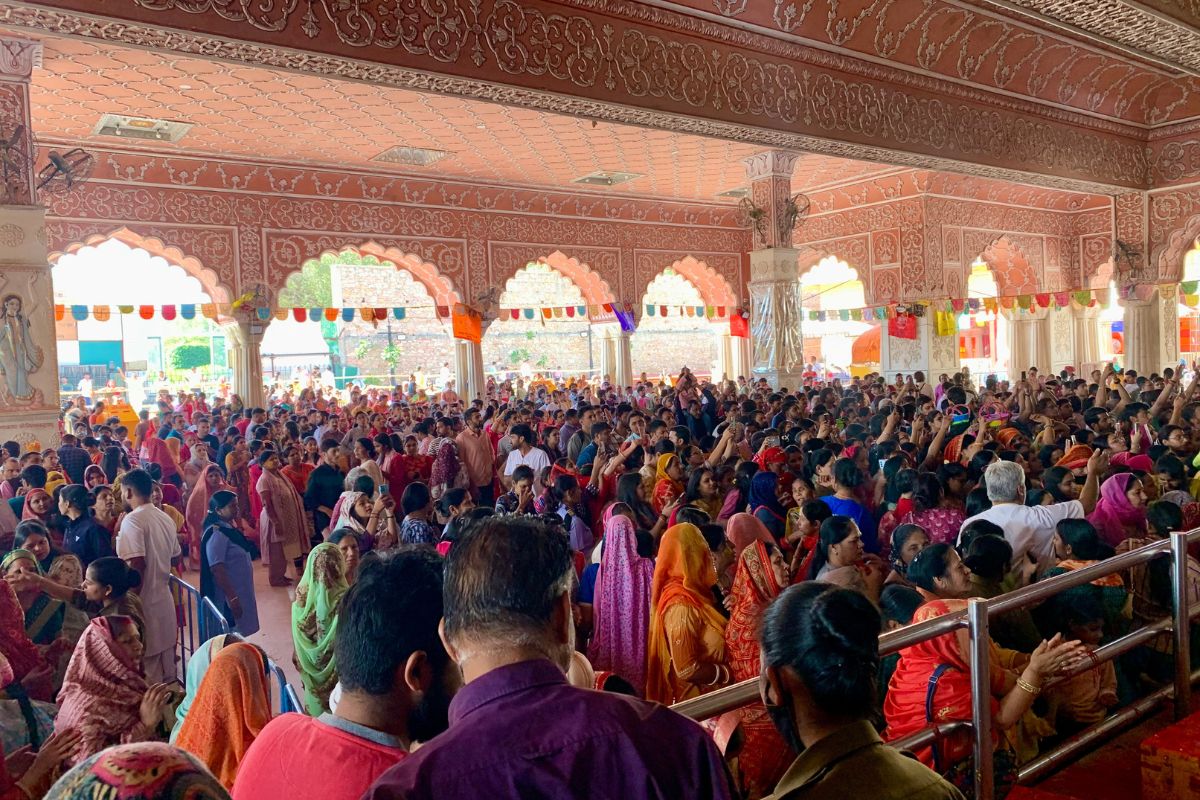 people worshiping at a Hindu temple