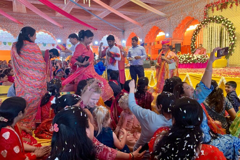 flower petals shower during a Holi Temple celebration