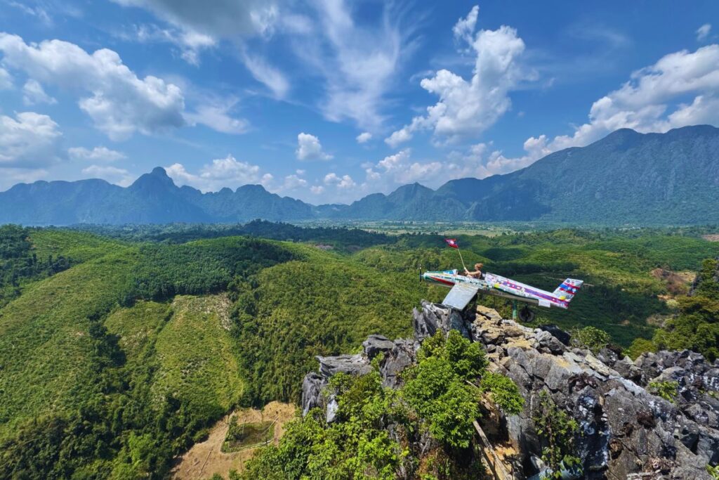 person in an airplane on top of a mountain