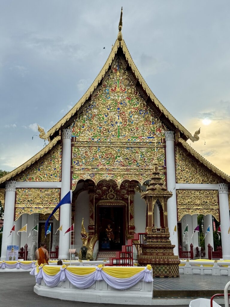 golden artwork on the facade of a Buddhist temple