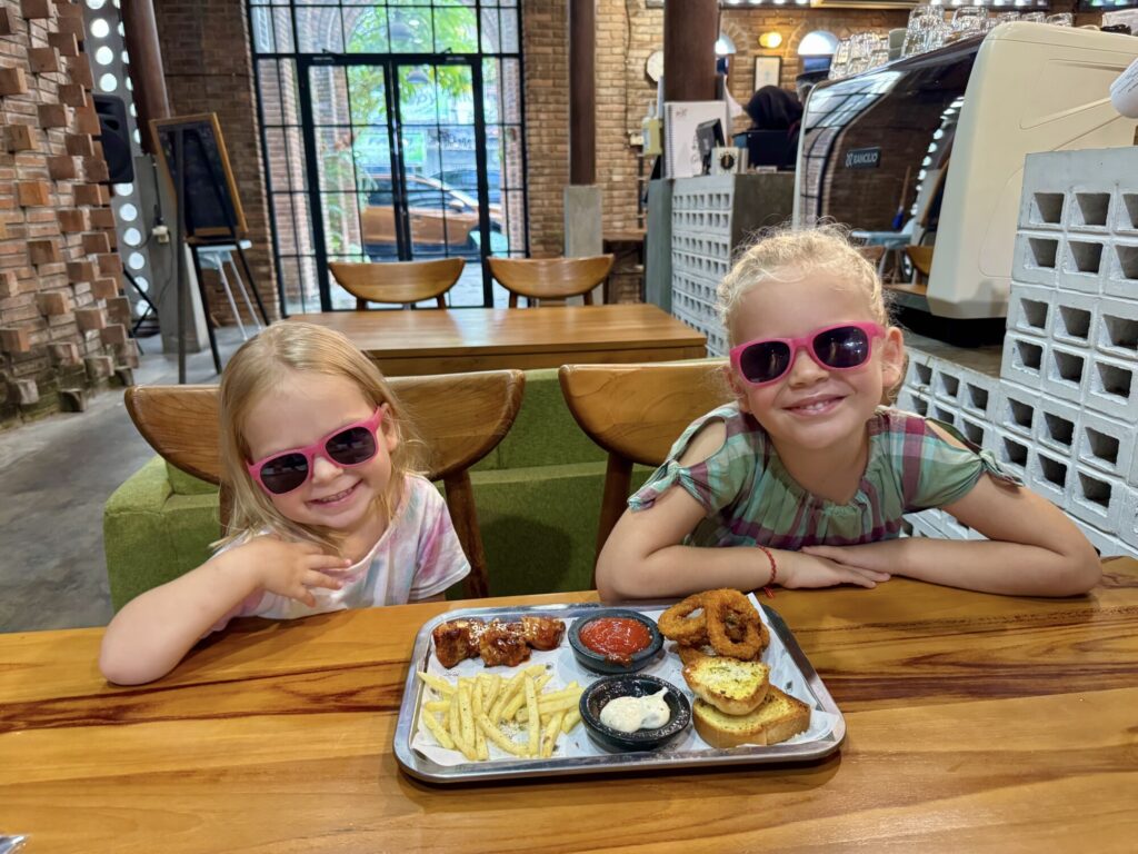two kids with a plate of food