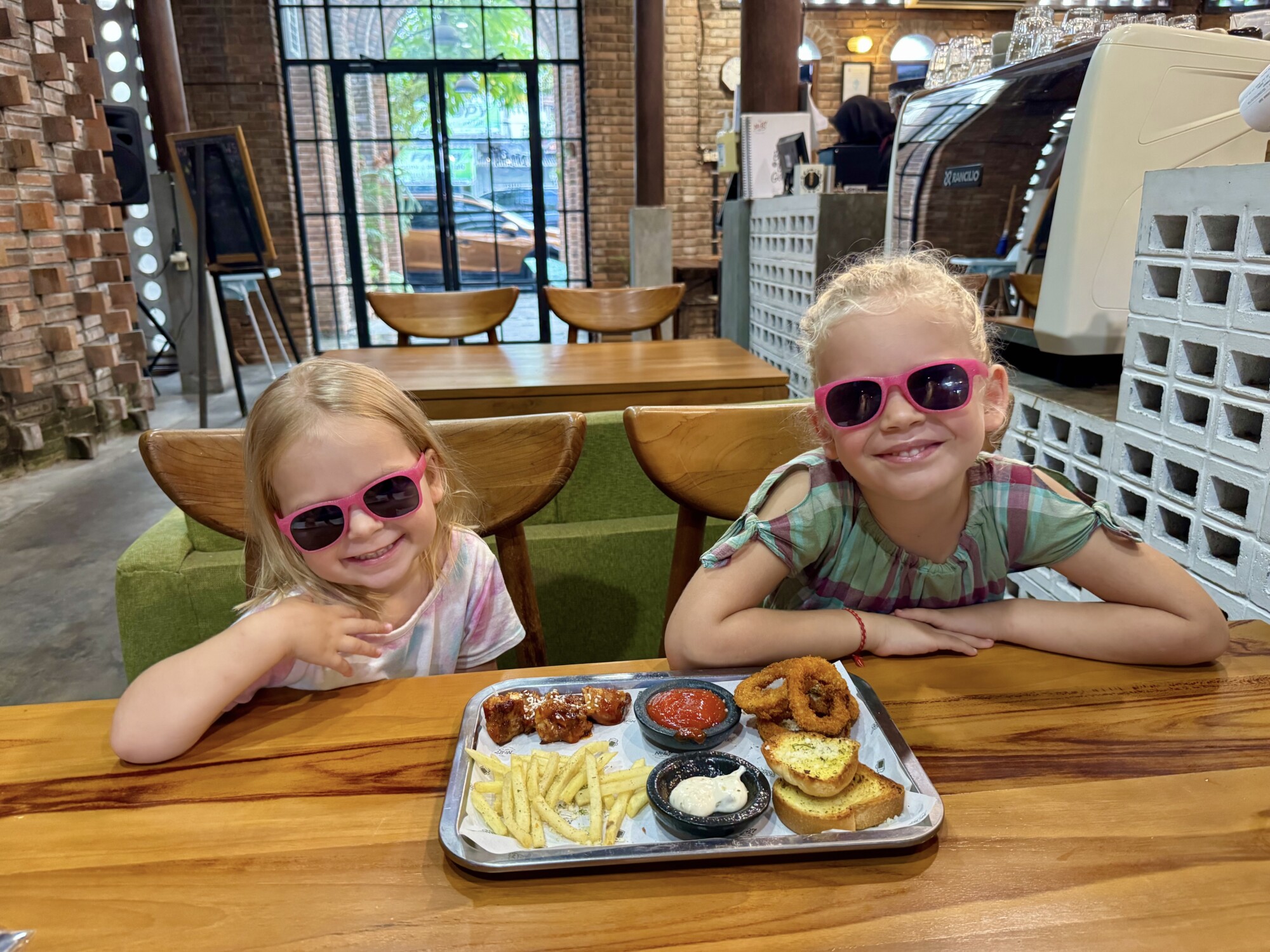 two kids with a plate of food