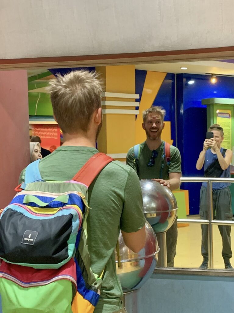man with hands on electrostatic with hair spikey