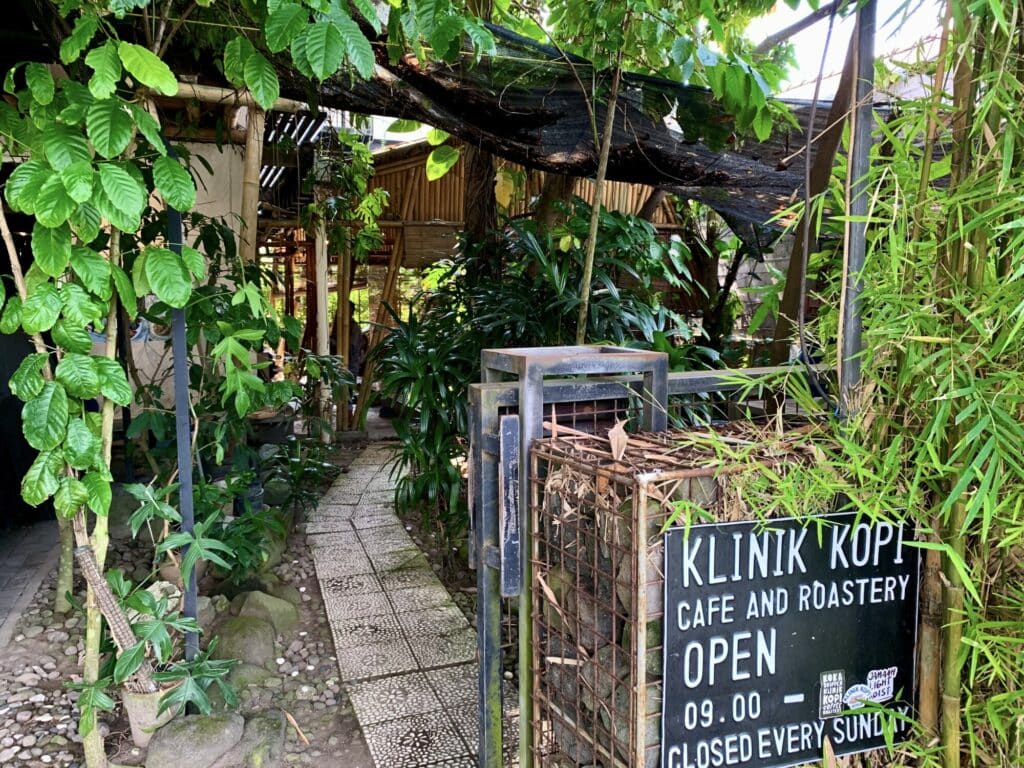 opening hours and greenery entrance to Klinik Kopi