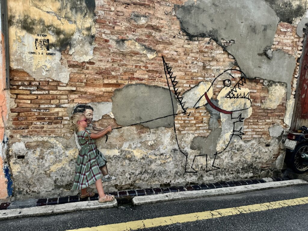 girl walking a pet monster mural