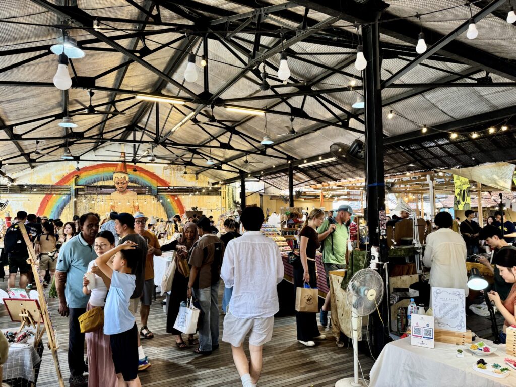 people shopping in a market for artisanal goods