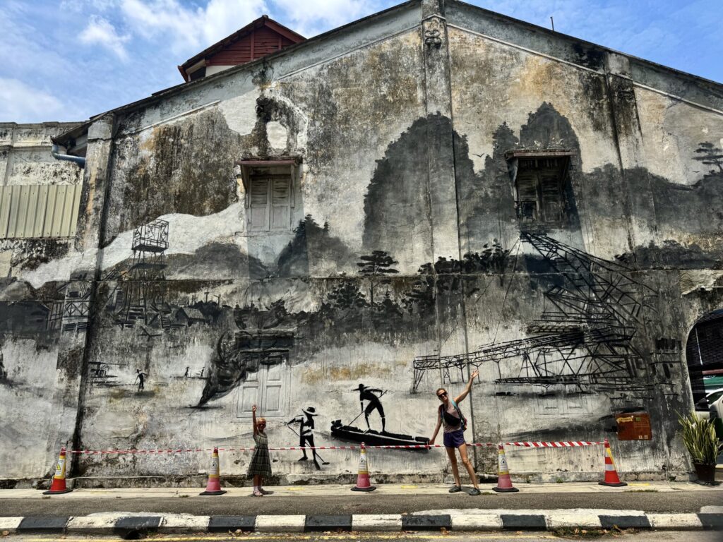 large industrial and mining mural on the side of a building