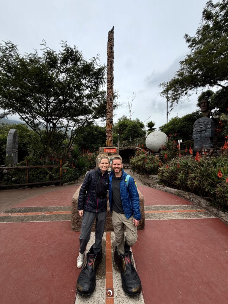 two people standing on the equator line