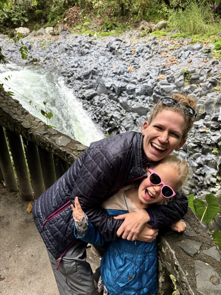 Woman and daughter at a waterfall