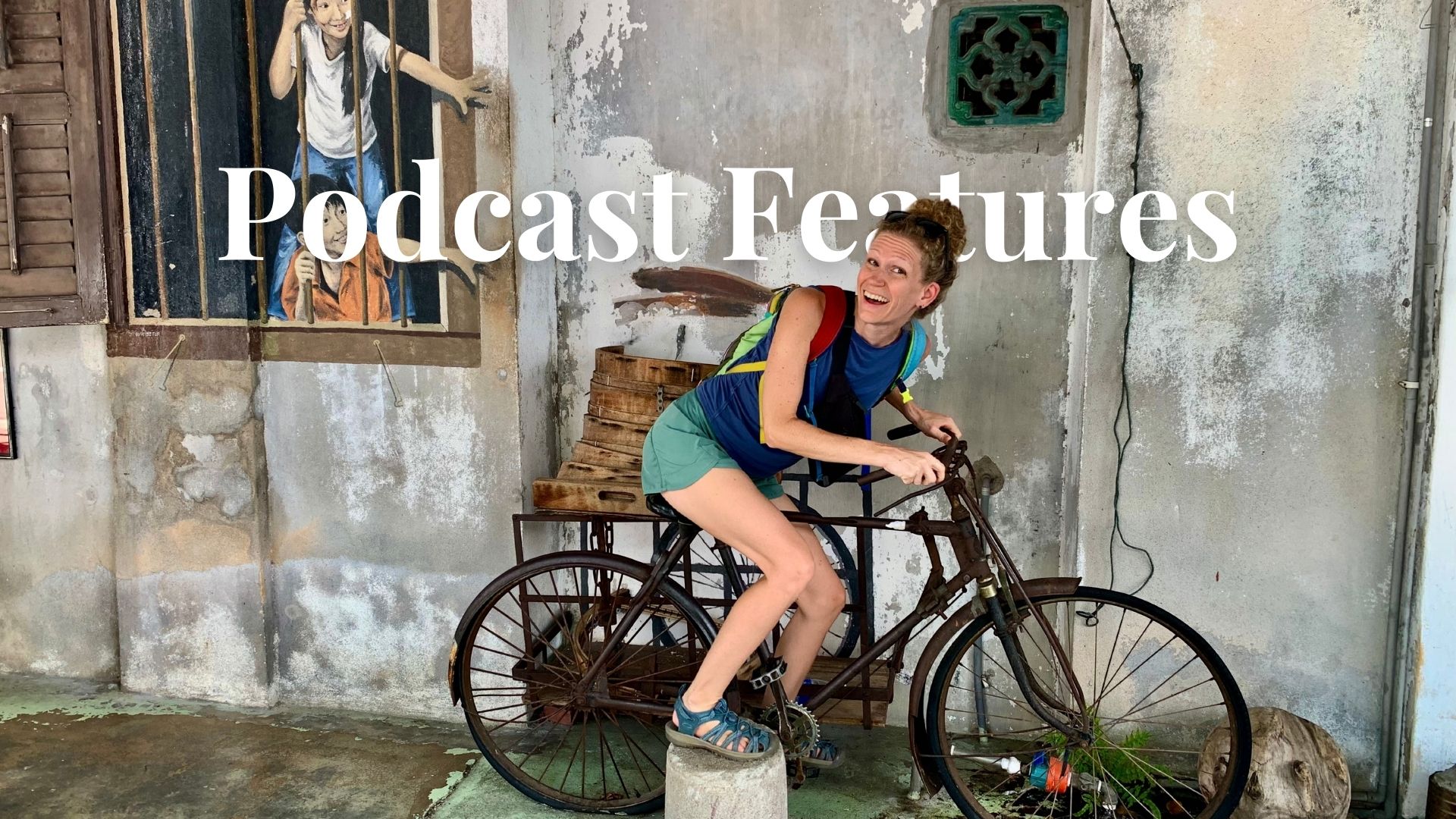 woman riding a bike at an interactive street art exhibit