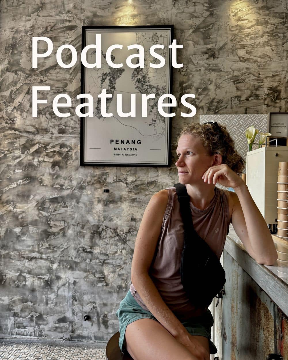 woman sitting at a coffee shop looking off into the distance