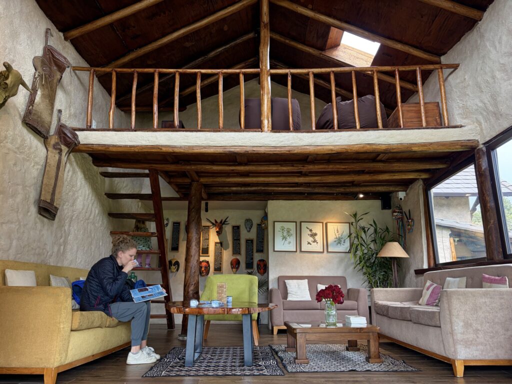 woman drinking tea in a wooden lodge