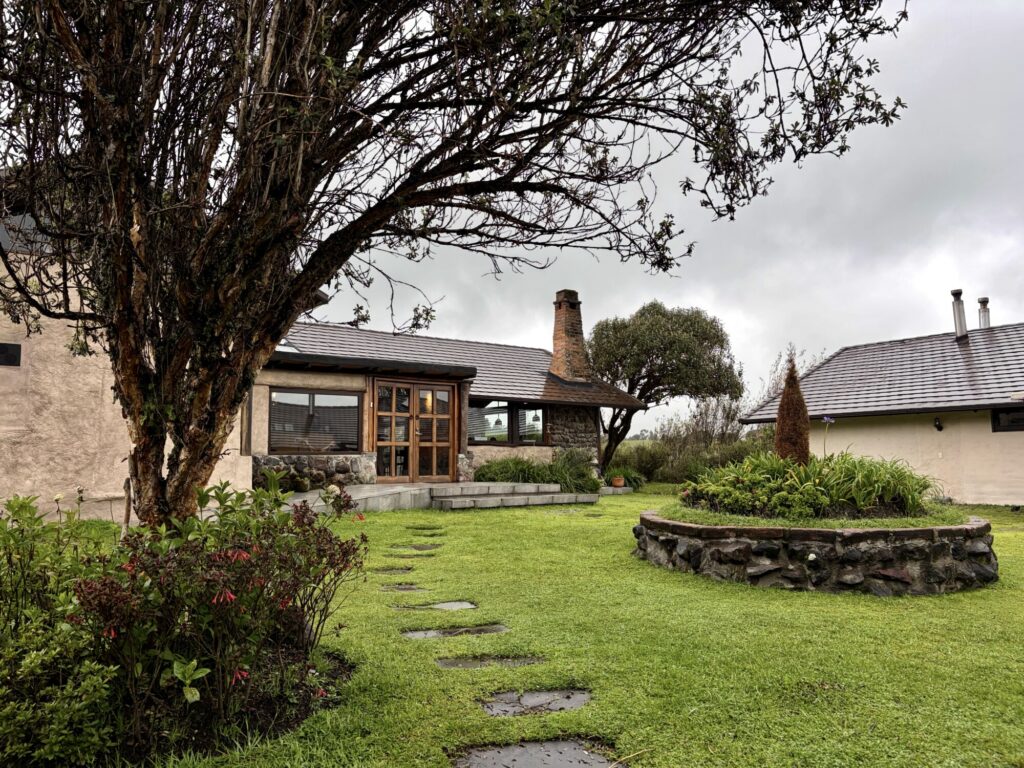 exterior of a lodge with grass, stone