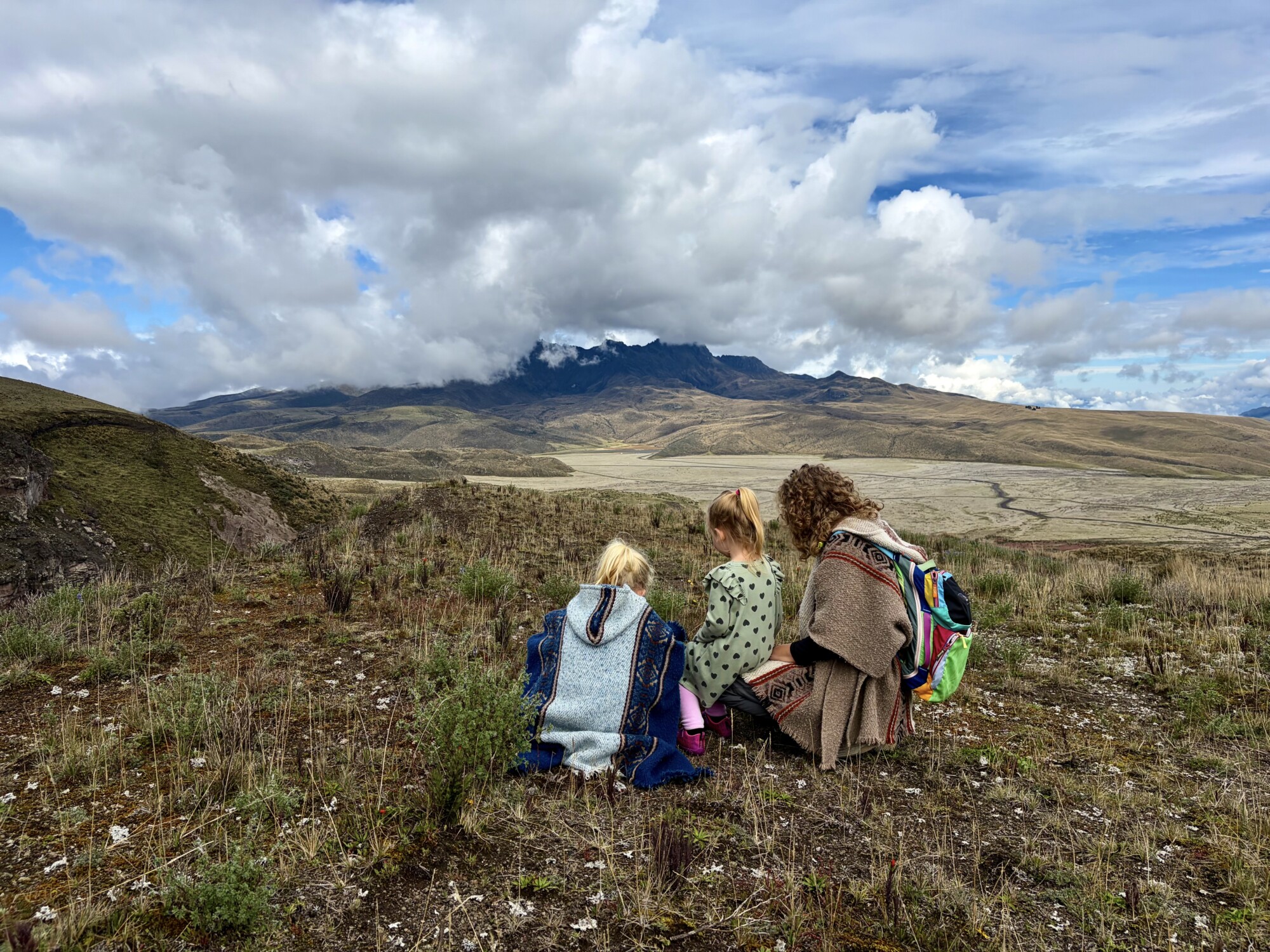 three people sitting in a national park