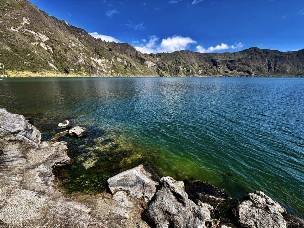 lake shore of a crater lake with turquoise water