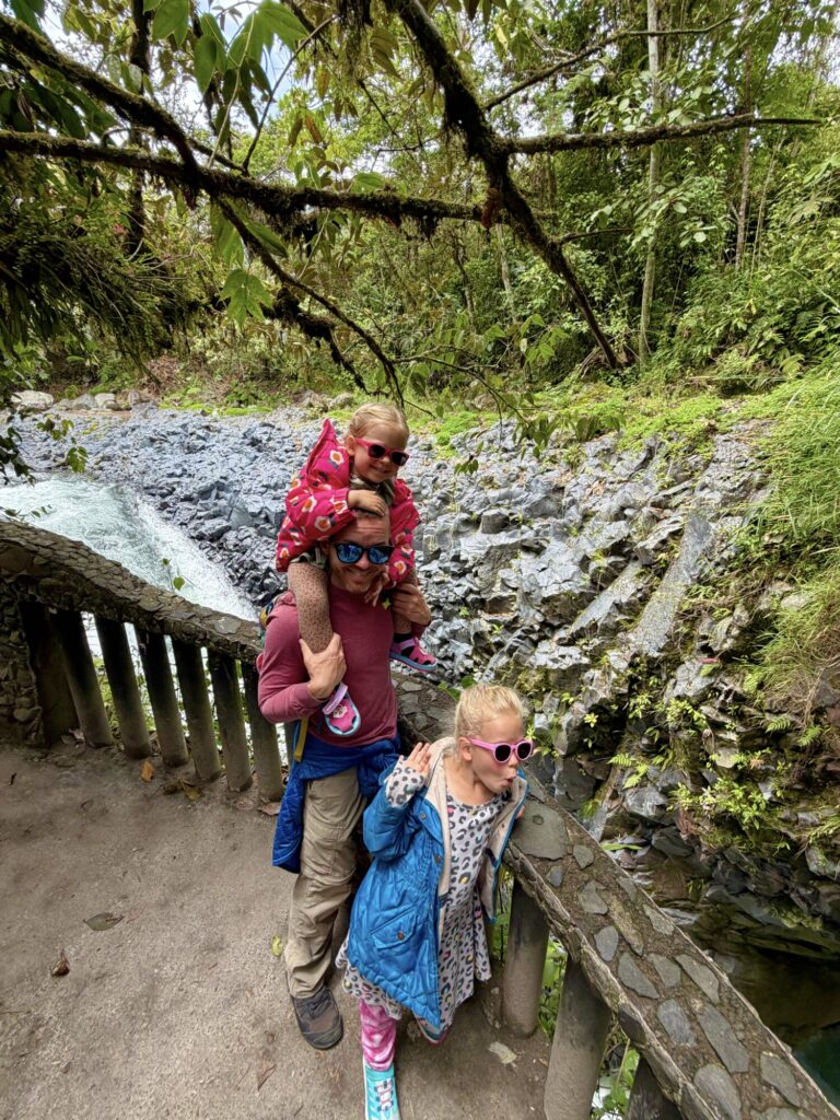 kids looking at a top of a waterfall