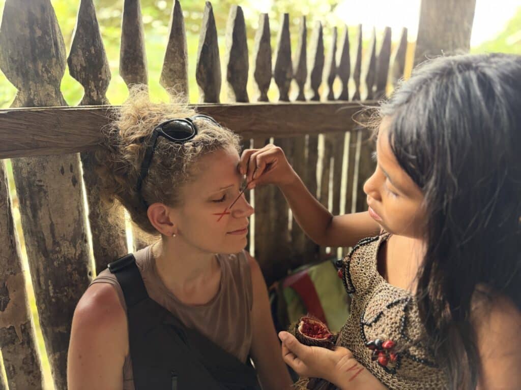 woman getting traditional face painting