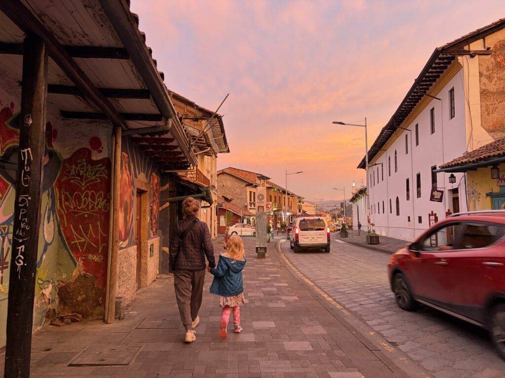 sunset with colorful orange, purple sky in a city