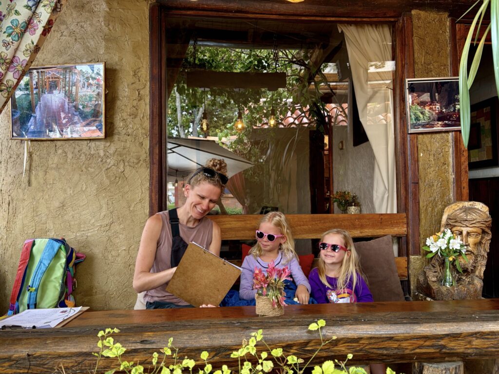 family ordering food at a cafe that is outdoors