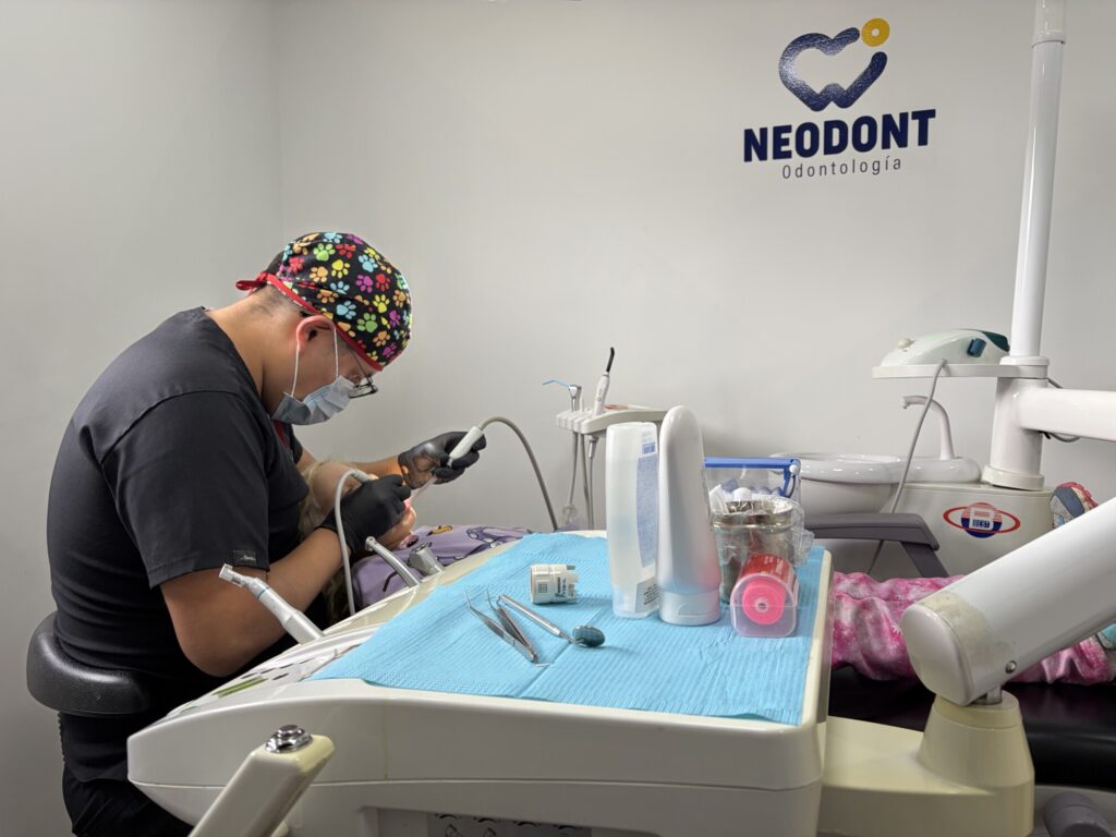 a girl getting her teeth cleaned at a dentist office