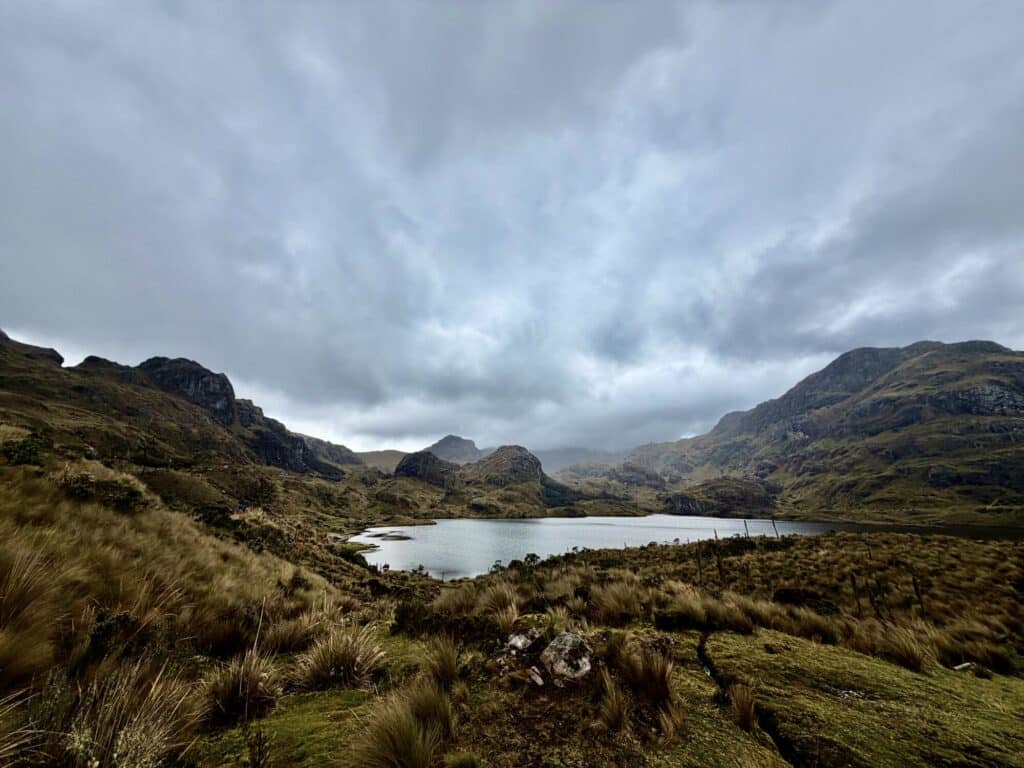 open landscape of a lake and surrounding mountains