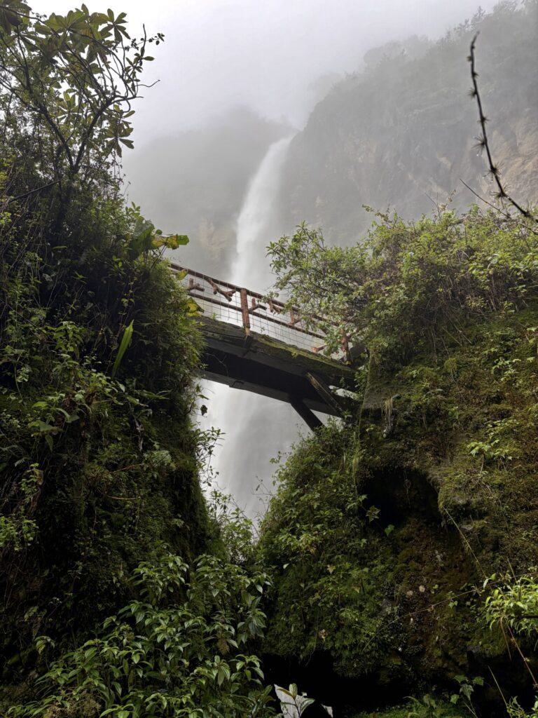 large waterfall with a bridge