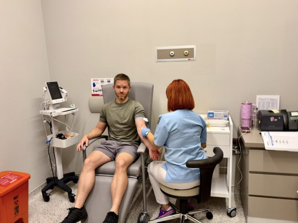 a man waiting to get his blood drawn