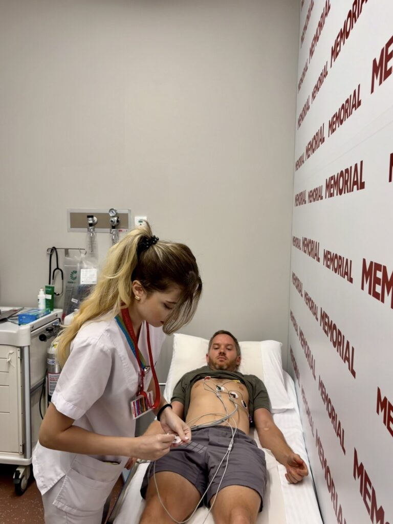 a man getting an ECG with electrodes on his chest